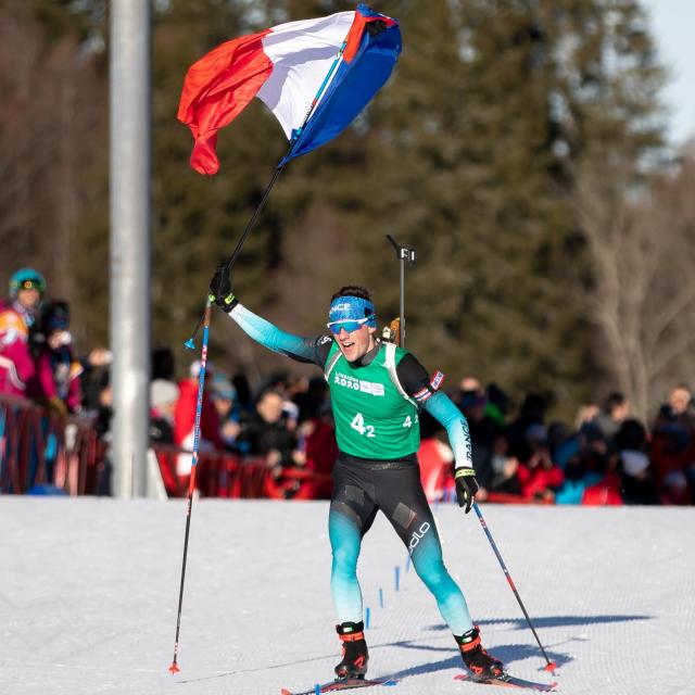 Mathieu Garcia FRA carries a French flag as comes to take the Gold Medal with Jeanne Richard FRA in the Biathlon Single Mixed Relay at Les Tuffes Nordic Centre in France. The Winter Youth Olympic Games, Lausanne, Switzerland, Sunday 12 January 2020. Photo: OIS/Simon Bruty. Handout image supplied by OIS/IOC